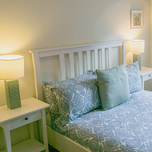 Garden room bed and bedside table